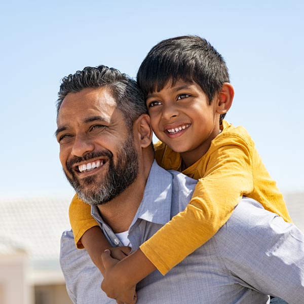 father and son smiling